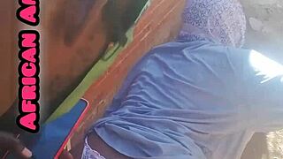 African beauty gives a blowjob to a big black cock