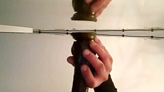 Gay man's solo play with sex toys in front of the mirror