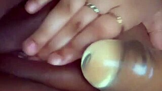 A horny teen explores her shaved and moistened genitals