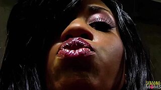 A stunning brunette woman drools on a chocolate penis before being vigorously penetrated and receiving a facial