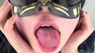 Spitting fetish explored with Asian performer's saliva play