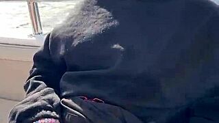 A couple's romantic encounter on a yacht in public