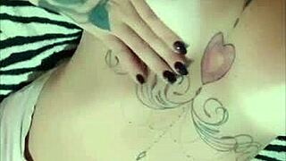 Redhead with hot ink flaunts suntan on webcam
