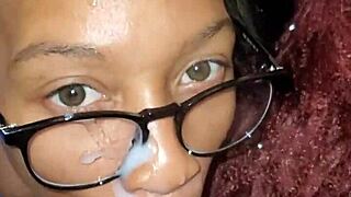 African American woman gets a cumshot on her face