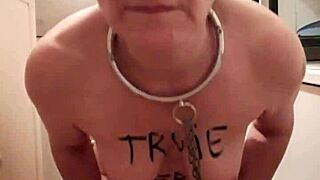 A submissive slave's self-induced orgasm while locked in chastity