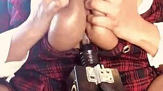 Huge breasted woman gets penetrated by machinery in a titty fuck scene