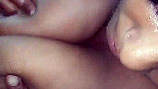 Mature black woman gets her breasts fondled in a car