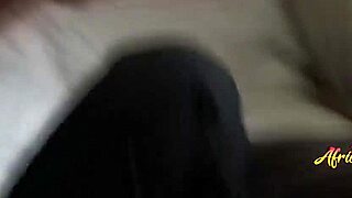 Sensual ebony lesbians indulging in gentle bedroom play