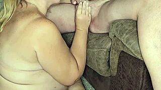 A voluptuous mature woman expertly services a well-endowed partner with oral pleasure