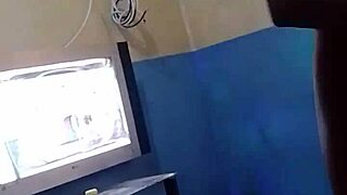A young and beautiful black girl shows off her natural assets while dancing