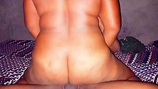 A voluptuous woman straddling a large penis