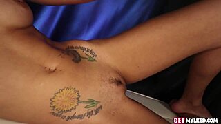 Petite brunette with natural assets offers tattooed handjob to client