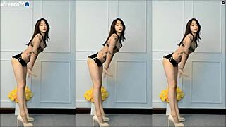 Asian cam girl shows off her moves and big tits in this steamy video