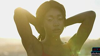 Cameroonian beauty Mimi Desuka's poolside undressing for Playboy