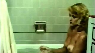 Beautiful blonde disrobes in a sexy bath scene in HD.