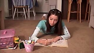 Young girl with small breast plays with a crayon in her vagina