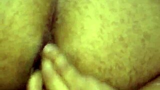 A gay man pleasuring himself by touching his anus.