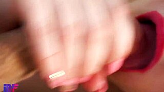 Beautiful woman with red lips gives blow job with passion.