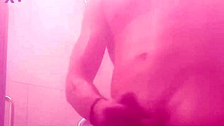 Steamy shower scene of a hot bodybuilder washing up and pleasuring himself
