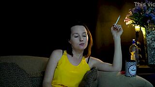 A brunette seductively blowing smoke and staring at you