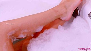 Beautiful brunette gets a sensual bath time exposure