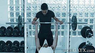 Interracial gay duo enjoys bareback sex in the gym