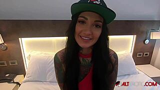 Adel Asanti is a tattooed beauty who performs a blowjob on a big cock