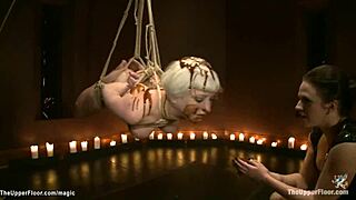 Chocolate-covered BDSM slave in a 3 woman scene