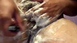 Amateur fat teen gets a shave in a voyeuristic shower scene