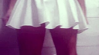 A skirt wearing ladyboy pleasuring herself
