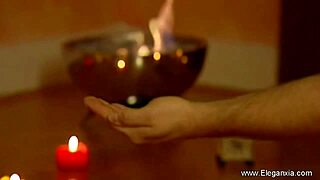 Steamy scene of an oiled up Indian couple in a sensual massage