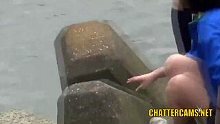 Young Asian amateurs pee outdoors in a spycam video