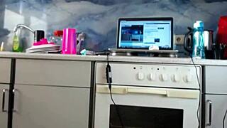 Shaved pussy amateur MILF masturbates on webcam in kitchen