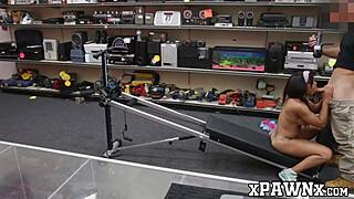 A petite woman has sex in a pawn shop after showing off her athletic skills