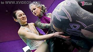 Muscular tattooed submissive gets teased and fucked by two dominants
