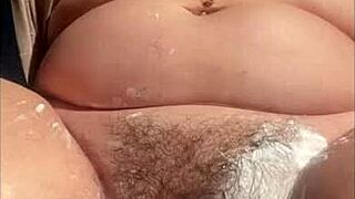 Close up of a shaved pussy with a squirting orgasm