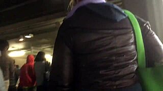 Street hidden camera captures a puffy nylon jacket wearing girl in action