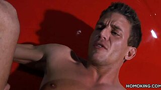 Gay men have sex on the roof of a shiny red car