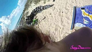 Beautiful woman enjoys a hot doggy style sex on the beach