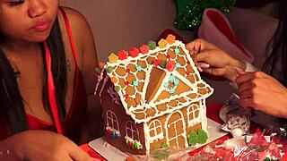 Two girls bake a gingerbread house for Christmas 2024