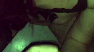 Goth chick gets a blowjob in a video booth