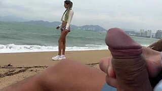 Skinny teen flashes his cock on public beach