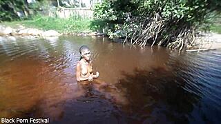 Small-boobed black ranch whore rides cock in river