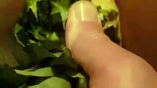 Pineapple insertion and fisting in a porn video