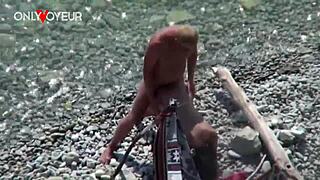 Public beach encounter between a voyeur and a wife who reveals her body and has oral and vaginal sex