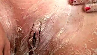 A big clit shave with a shower and pee fetish scene