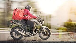 Young and amateur couple enjoys foreplay on a motorcycle
