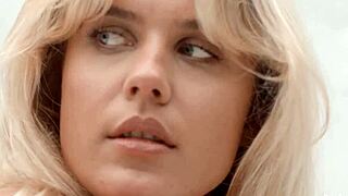 Blonde bombshell undresses to nothing in softcore tease