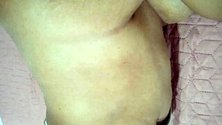 Tattooed MILF gets a sensual massage and masturbates