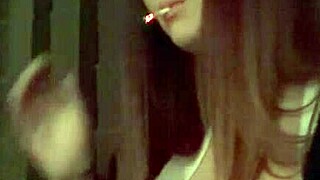 Italian MILF Artemisia enjoys smoking outdoors and flashing her big tits